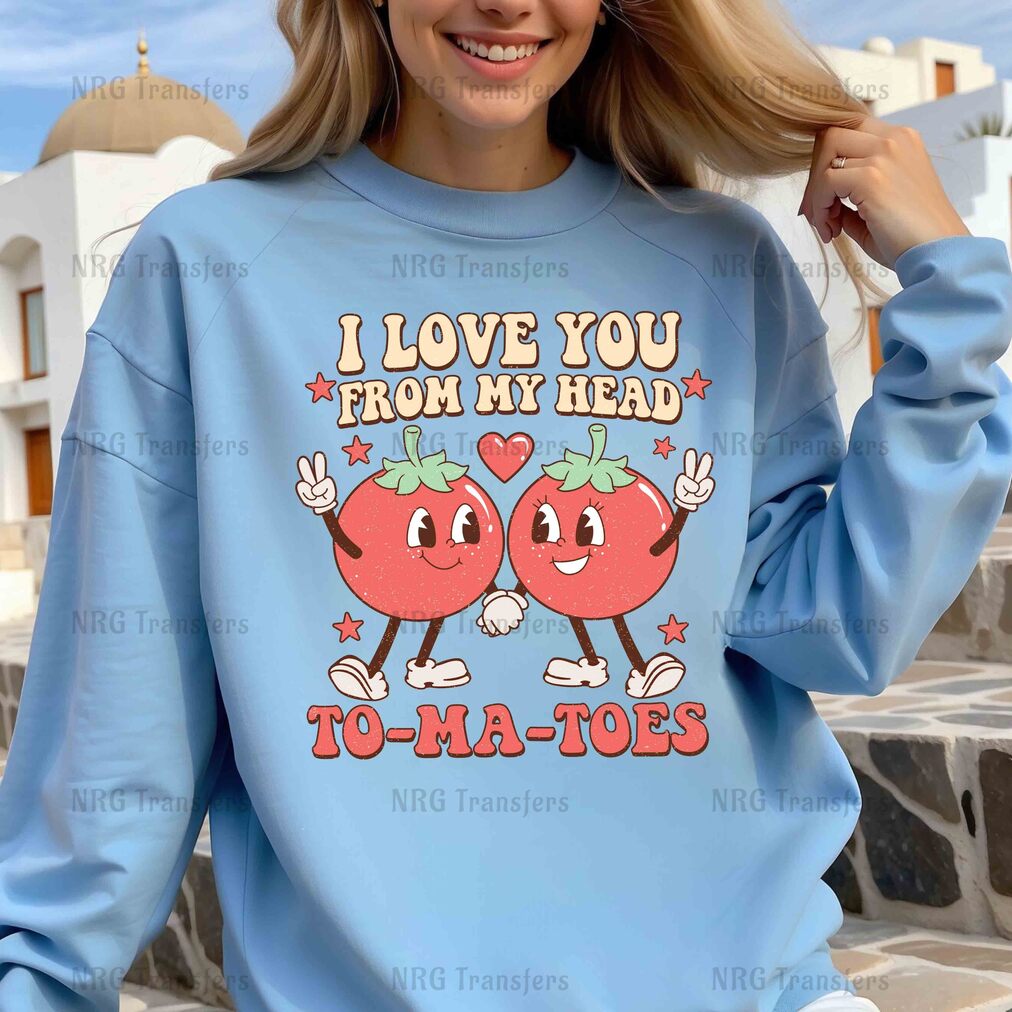 a woman wearing a blue sweatshirt that says i love you from my head to -