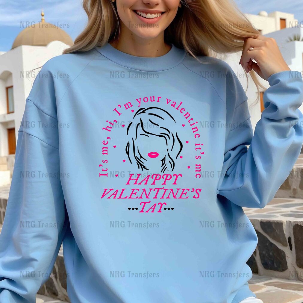 a woman wearing a blue sweatshirt that says happy valentine's day