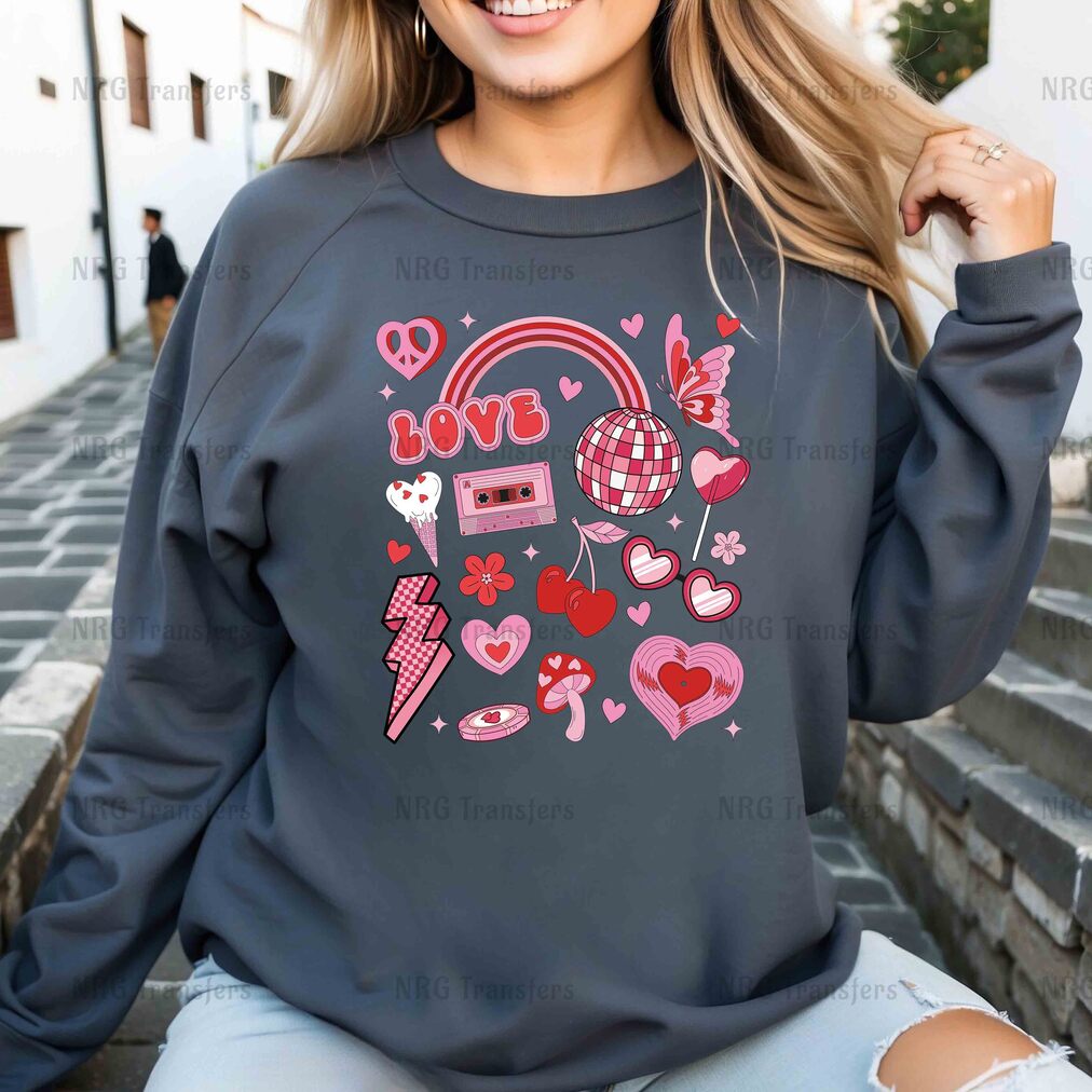 a woman wearing a sweatshirt with hearts and headphones on it