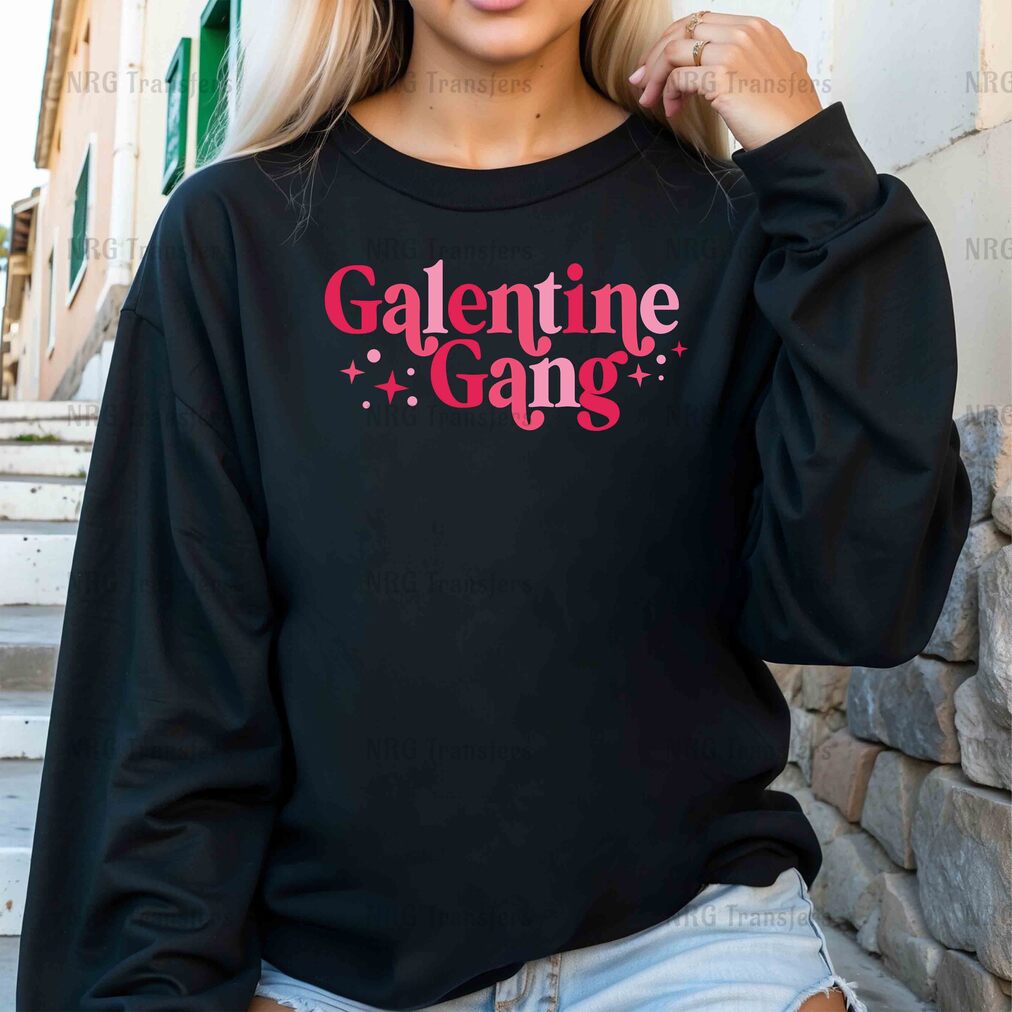 a woman wearing a black sweatshirt with the word'valentine gang'printed on it