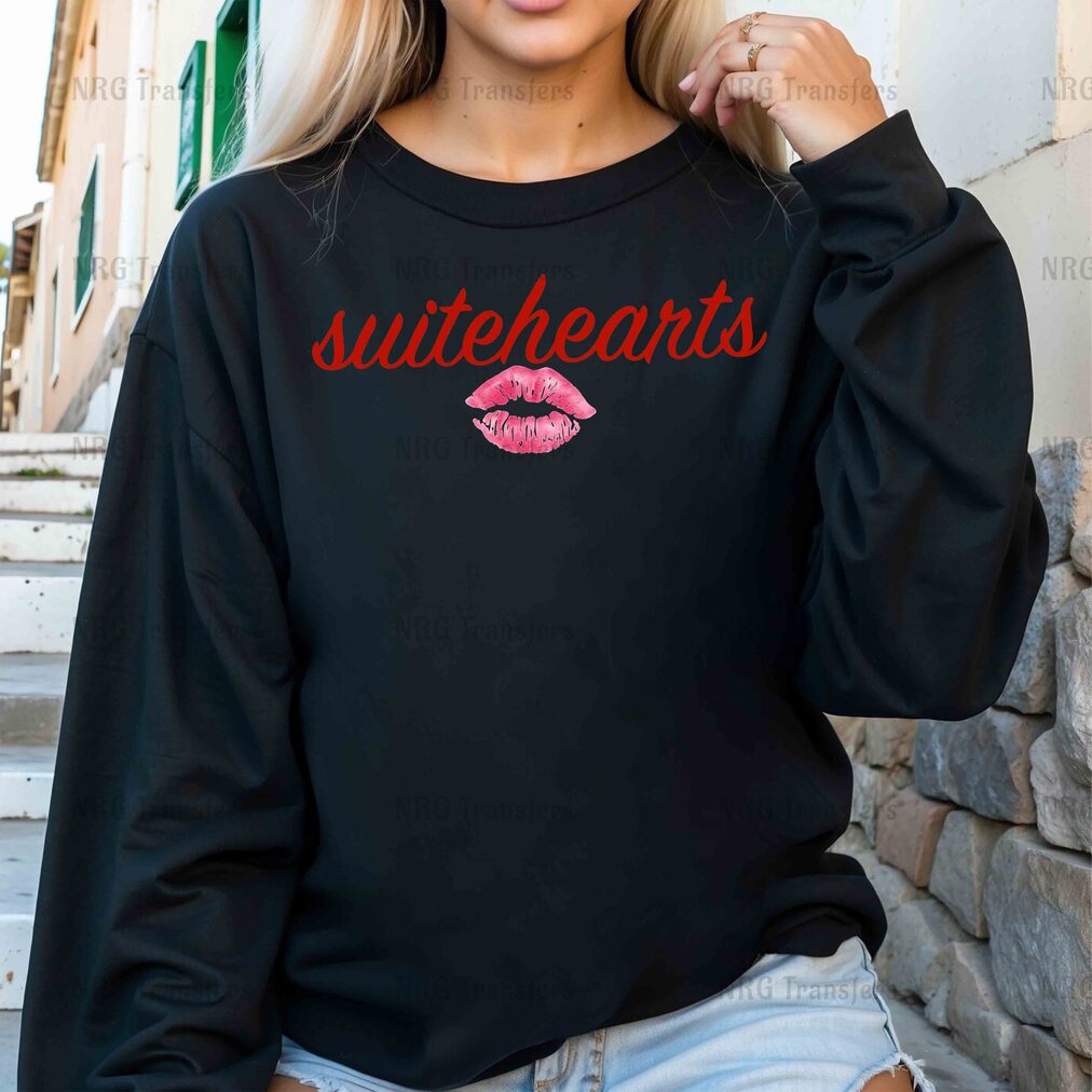 a woman wearing a black sweatshirt with red lipstick on it