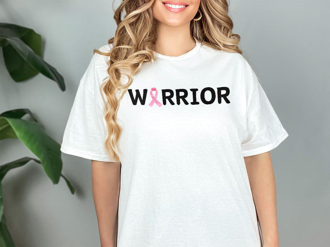 a woman wearing a white shirt with the word warrior on it