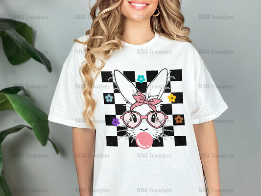 a woman wearing a white t - shirt with a rabbit on it