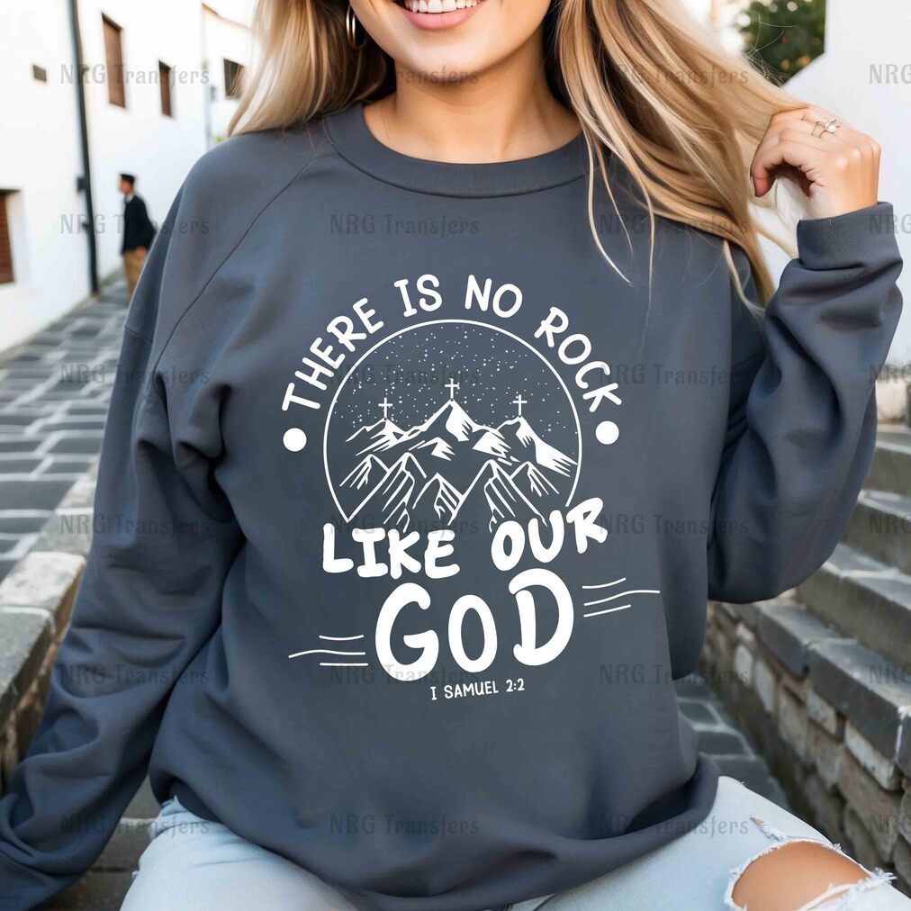 a woman wearing a sweatshirt that says, there is no rock like our god