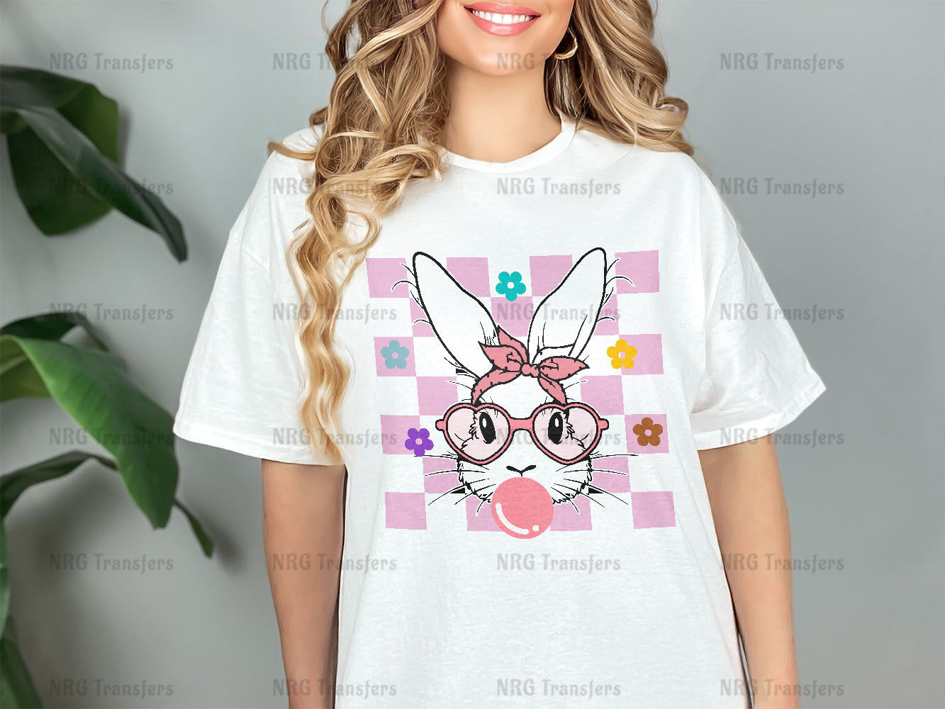 a woman wearing a white t - shirt with a bunny on it