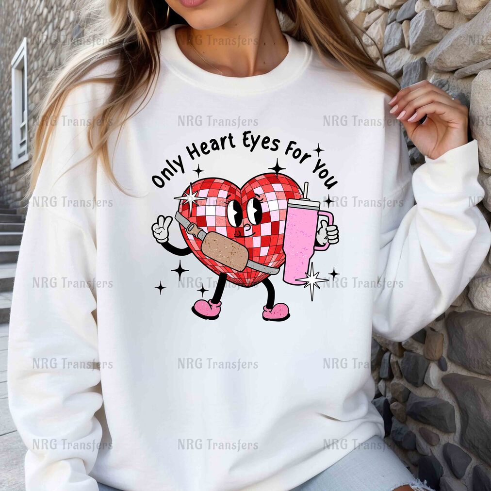 a woman wearing a sweatshirt that says only heart eyes you