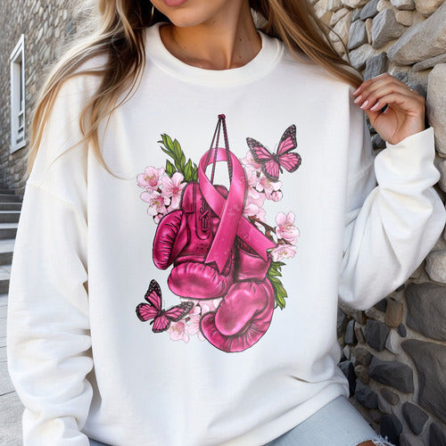 a woman wearing a white sweatshirt with pink boxing gloves on it