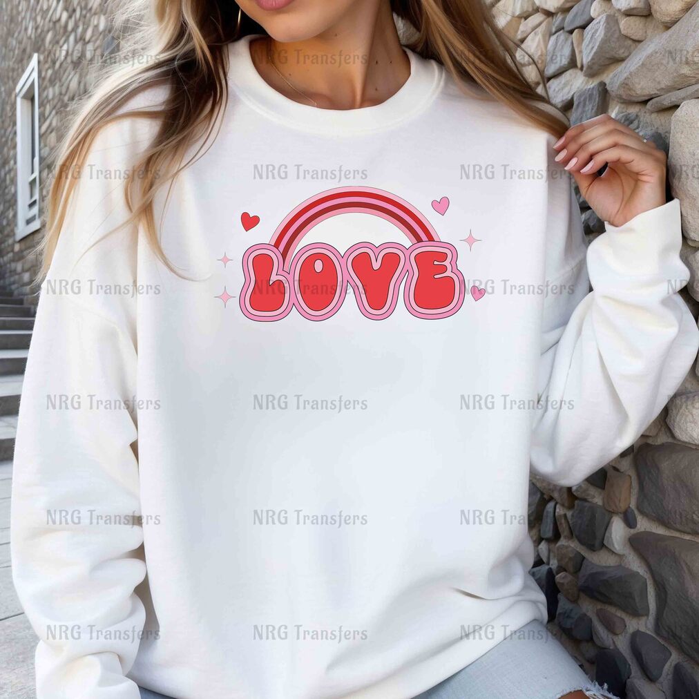 a woman wearing a sweatshirt with the word love on it