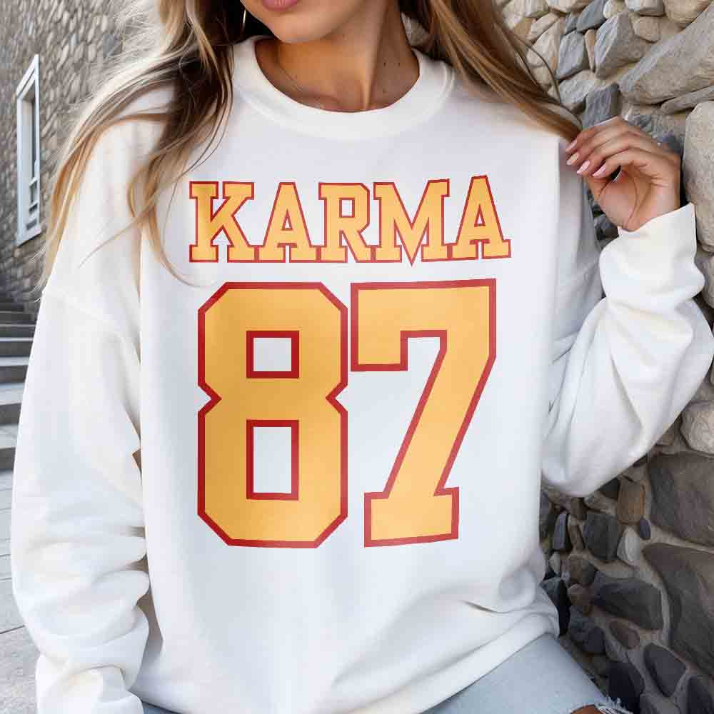 a woman wearing a white sweatshirt with a number on it