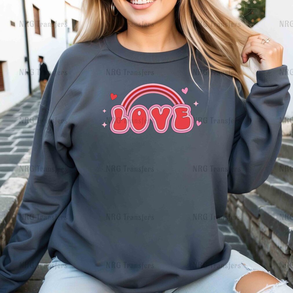 a woman wearing a sweatshirt with the word love on it