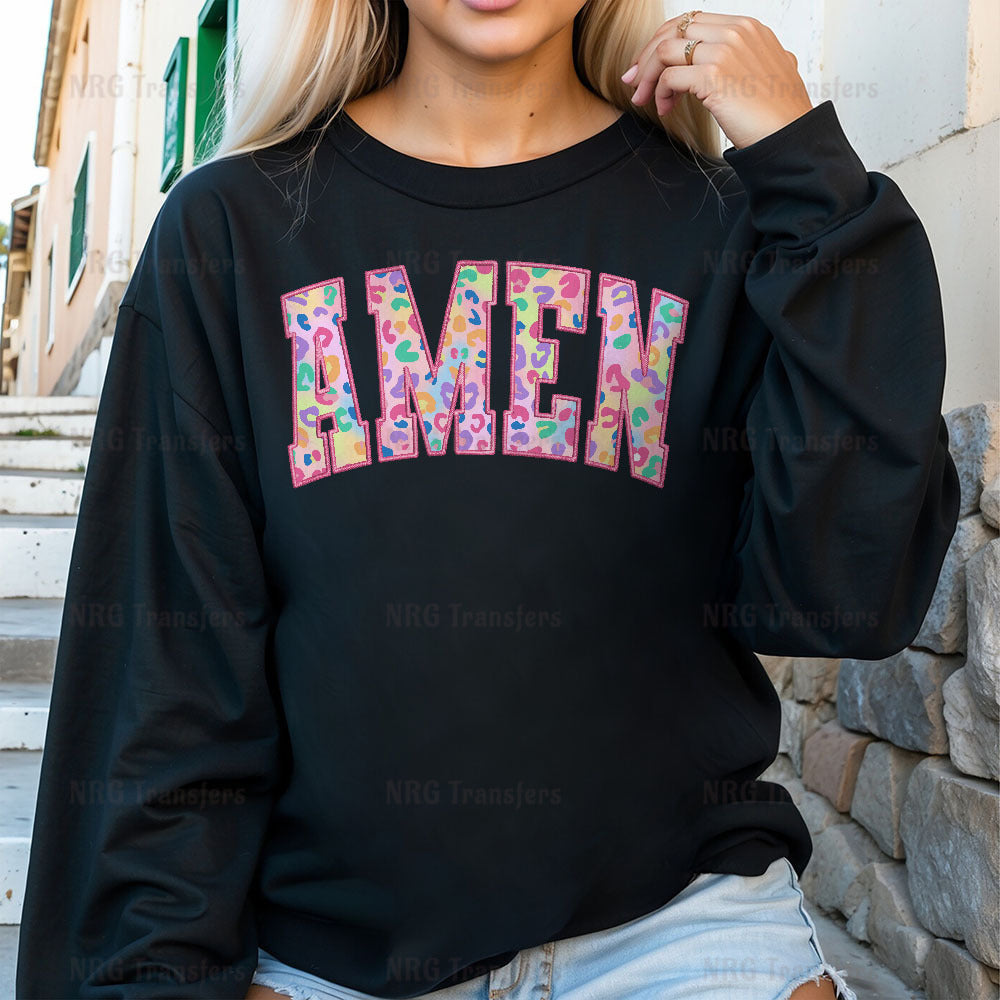 a woman wearing a black sweatshirt with the word amen printed on it