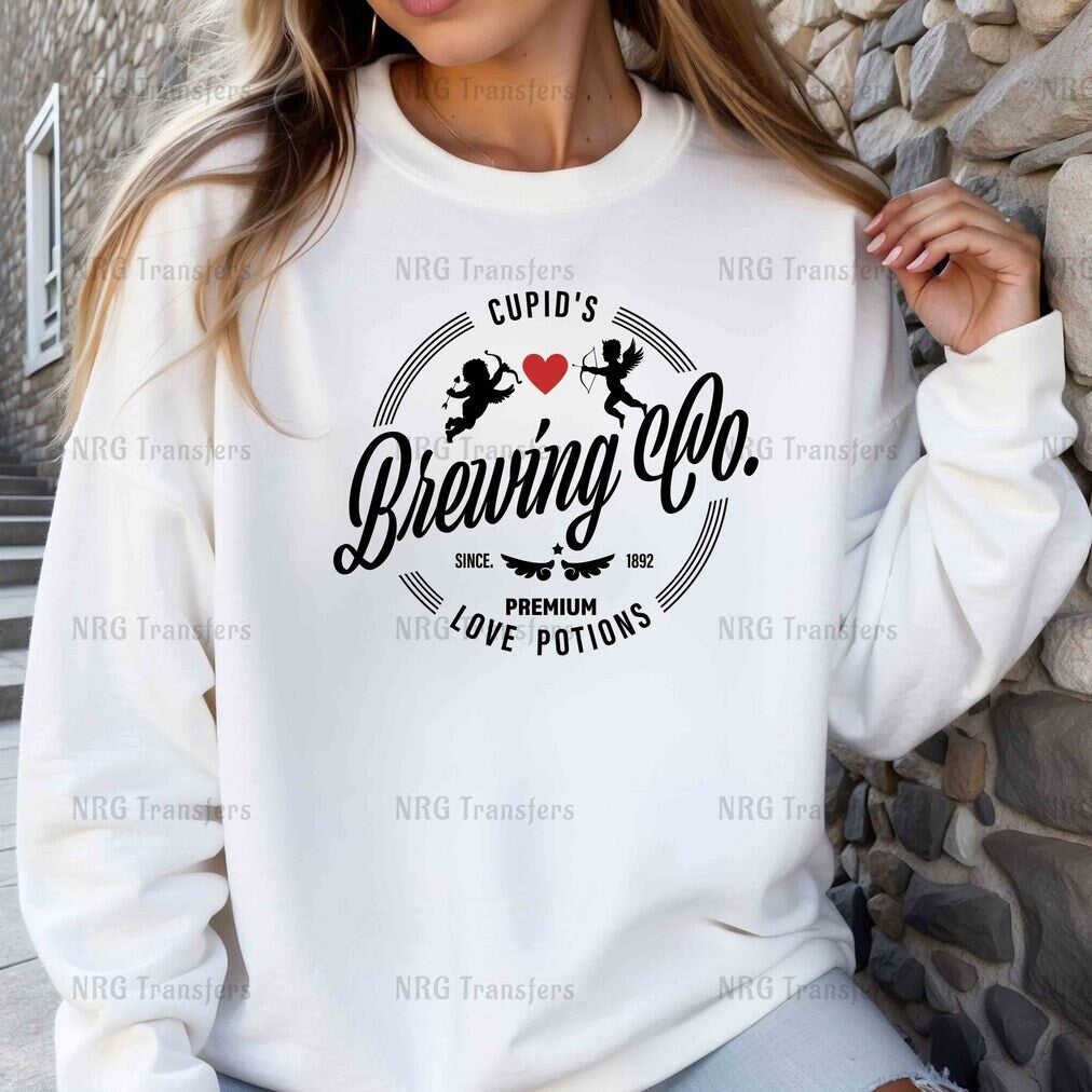 a woman wearing a white sweatshirt with the words brewing co on it